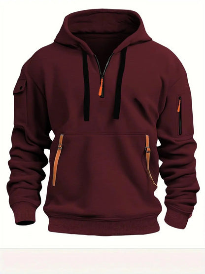 Burgundy version of the hoodie from the front, with black drawstrings, orange zip pull and orange pocket tabs. 5