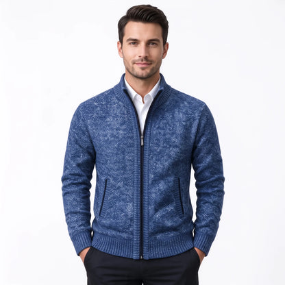 Model wearing the bright blue flecked cardigan zipped up over a white shirt and dark trousers 37