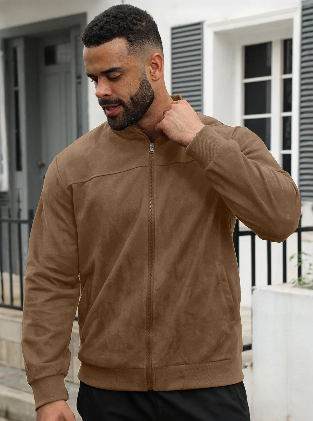 Back view of the light grey jacket laid flat, showing plain back panel and ribbed trims 38