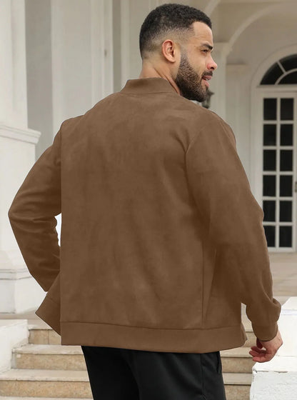 Man wearing the brown zip-up jacket outdoors, front view, one hand raised to his collar 39