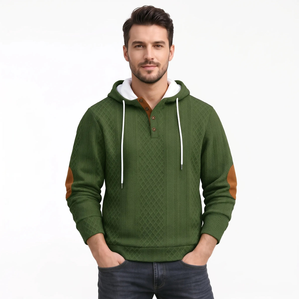Model in olive green textured hoodie with tan elbow patches, hands in pockets, plain background 39