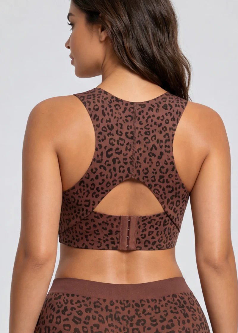 Back view of the leopard-print bra on a model, showing the keyhole cut-out and three-hook closure. 11
