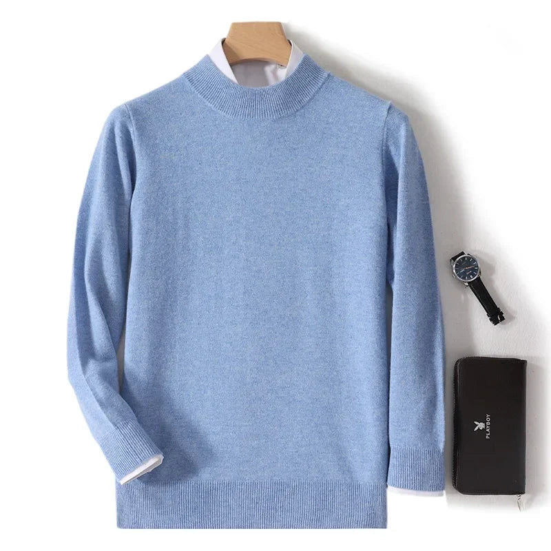 Light blue mock neck jumper on a hanger with white shirt layered underneath, watch and wallet alongside 3