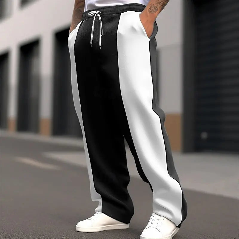 Street shot, lower body, of black and white colour-block sweatpants with white drawstring 3