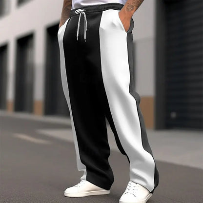 Street shot, lower body, of black and white colour-block sweatpants with white drawstring 3