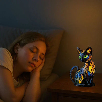 Cat lamp glowing warmly on a bedside table while a woman sleeps peacefully on a pillow 5