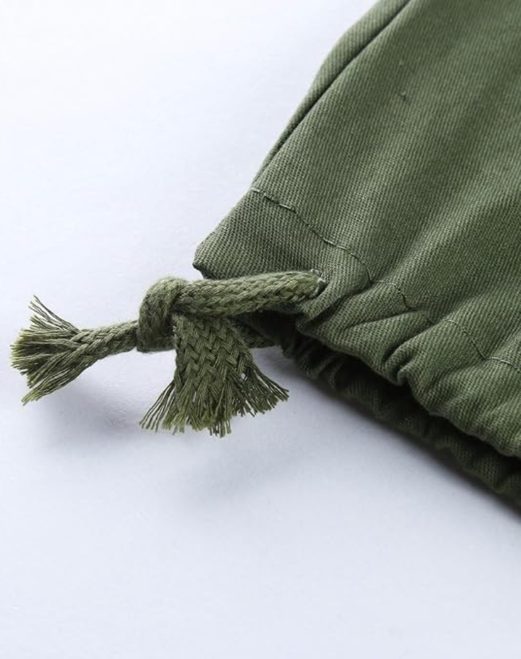 Close-up of the olive green trouser hem, showing a knotted drawstring cord with frayed ends and the gathered cuff. 12
