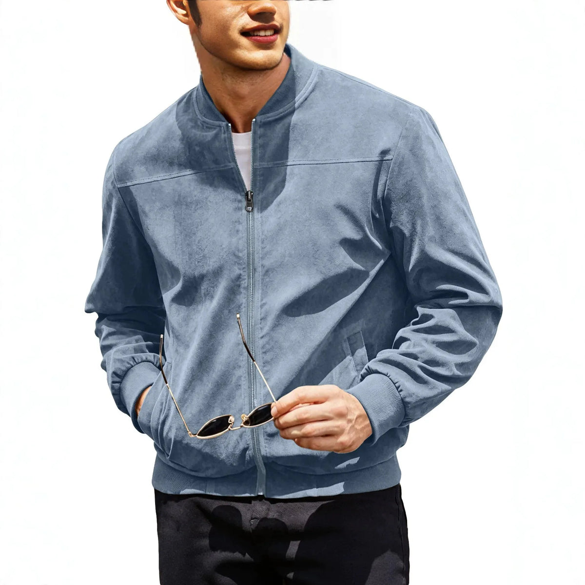Torso of a model in the light blue zip jacket, holding sunglasses and one hand in pocket 3