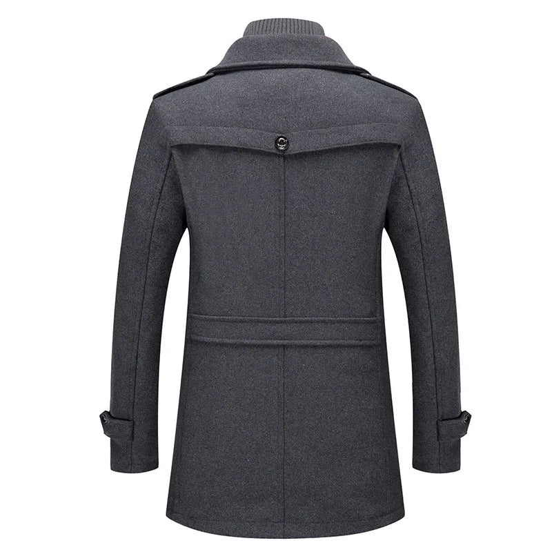 Back view of the grey overcoat, showing the buttoned yoke flap, waist strap and cuff tabs 3