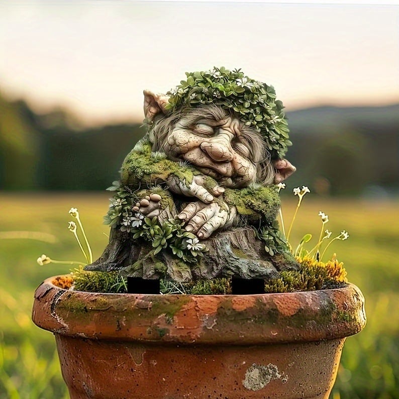 Sleeping troll with a leaf crown and folded hands on a stump, staked in an old terracotta pot. 17