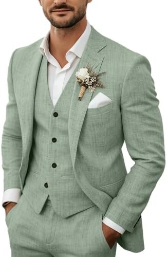 Model wears the sage green suit with waistcoat, white open-collar shirt, floral buttonhole and white pocket square. 4