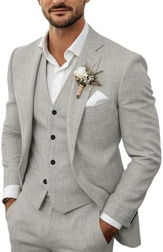 Model wears the light grey suit with waistcoat over a white shirt, finished with a floral buttonhole and pocket square. 5