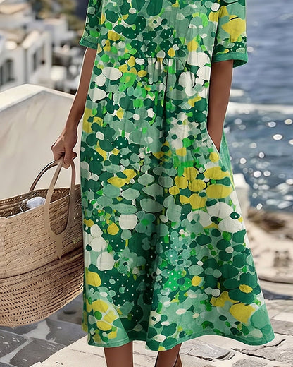 Lower-body detail of the green floral dress showing the flowing skirt and side pocket 7