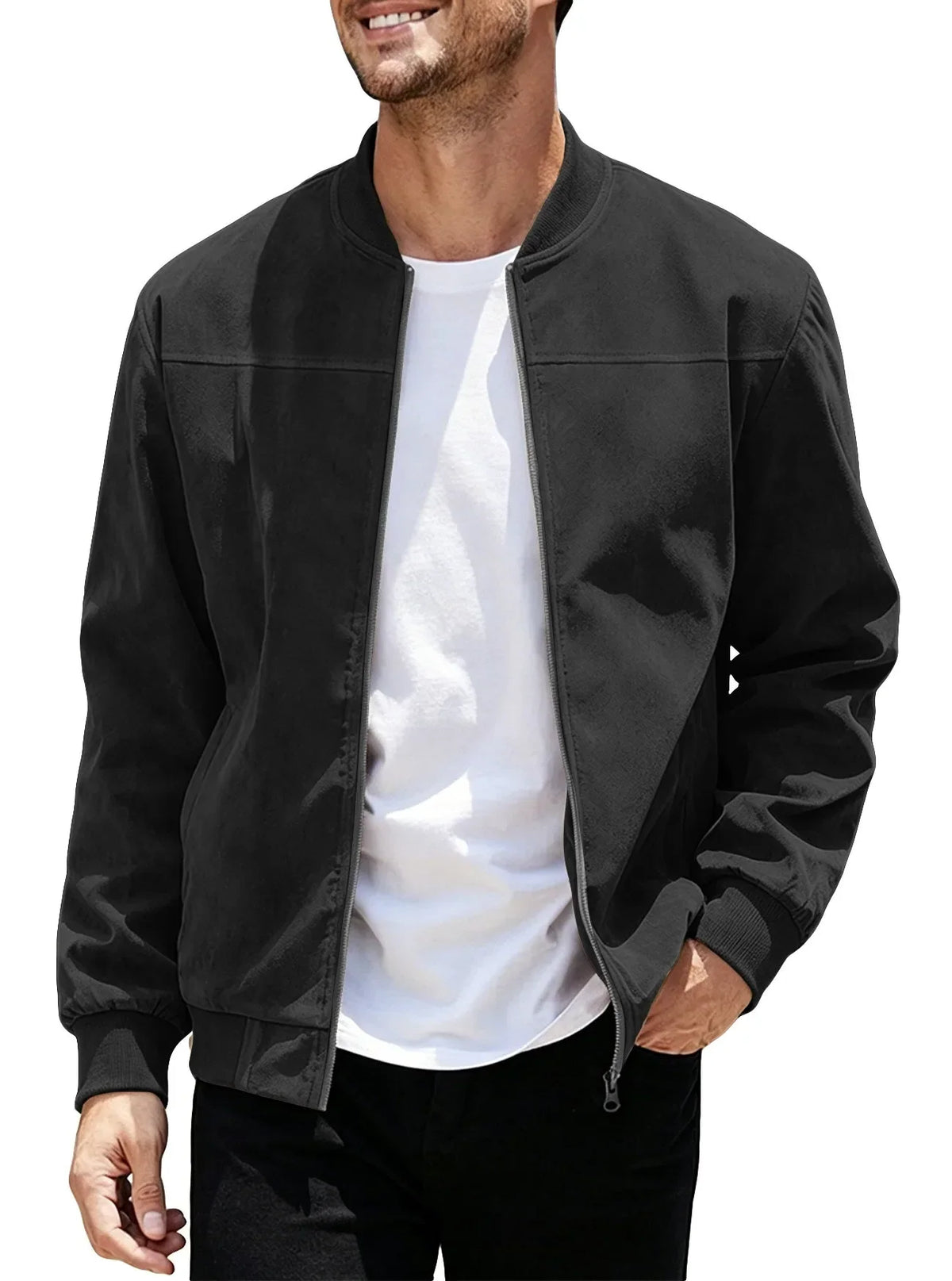 Smiling model wearing the black jacket unzipped over a white tee, one hand in pocket 42