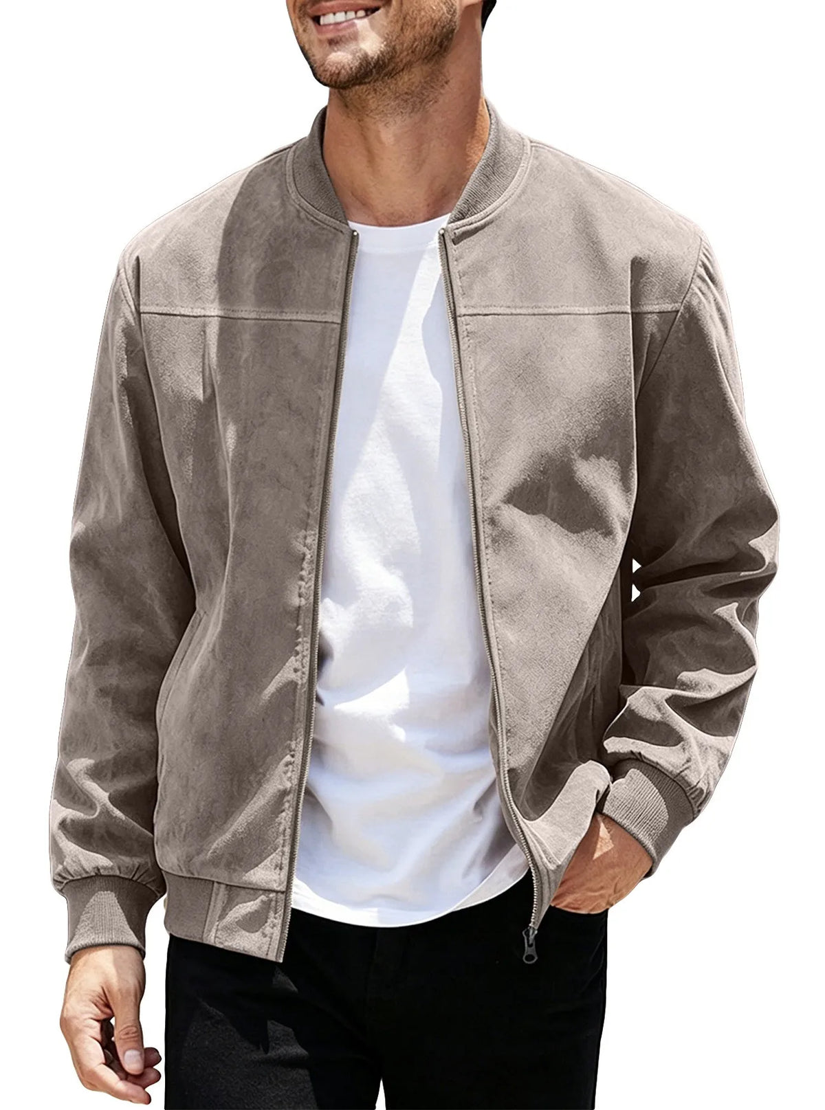 Smiling model wearing the taupe jacket unzipped over a white tee, one hand in pocket 43