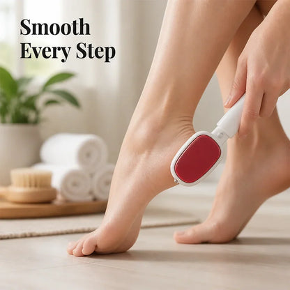 Woman using the white-handled foot file with red pad on her heel in a bright bathroom 1