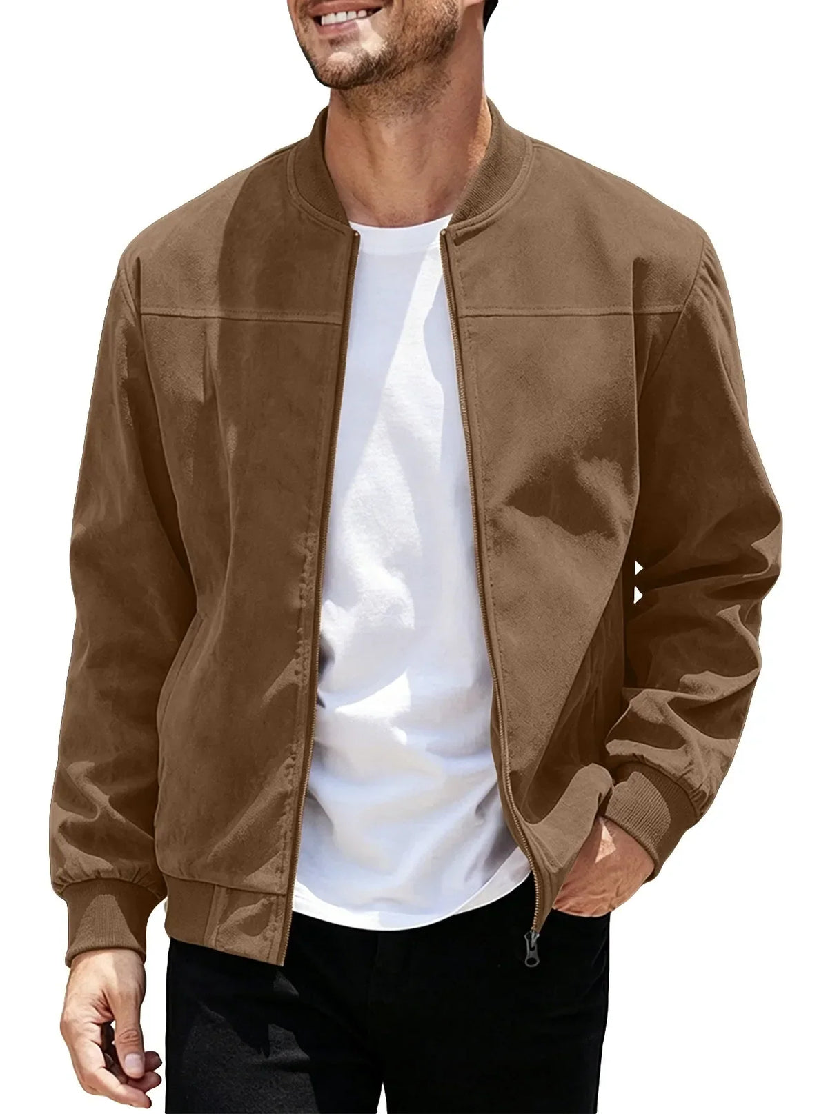 Smiling model wearing the brown jacket unzipped over a white tee, one hand in pocket 45