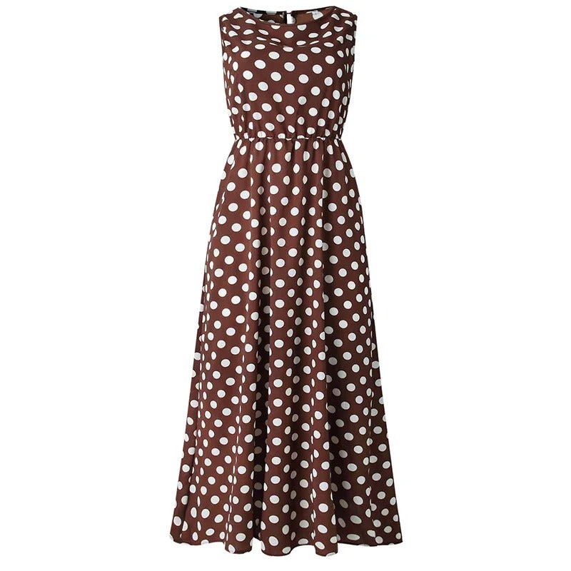 Brown sleeveless midi dress with white polka dots, shown flat from the front with an elasticated waist and flared skirt. 1