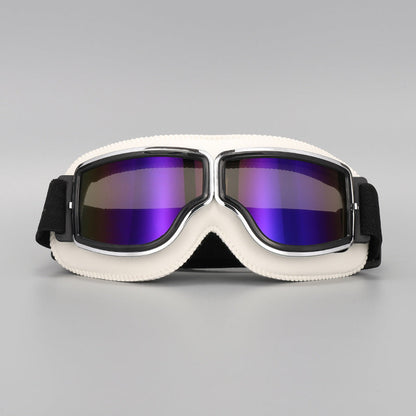 Front view of the cream-white padded goggles with chrome trim and purple mirrored lenses. 15