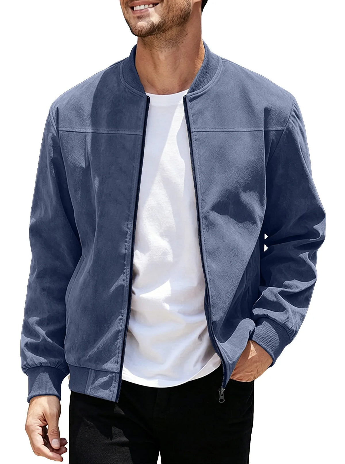 Smiling model wearing the navy blue jacket unzipped over a white tee, one hand in pocket 48