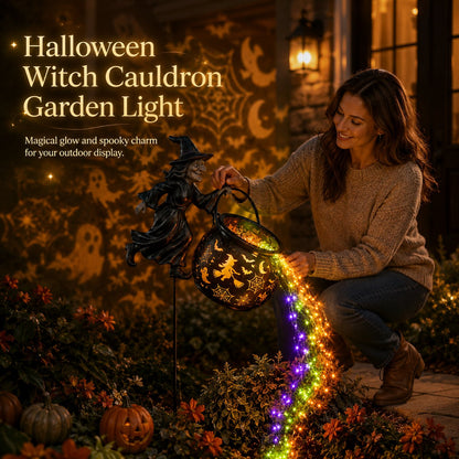 Smiling woman crouches in a garden at night, tilting the witch-and-cauldron stake as purple, green and orange lights pour out. 1