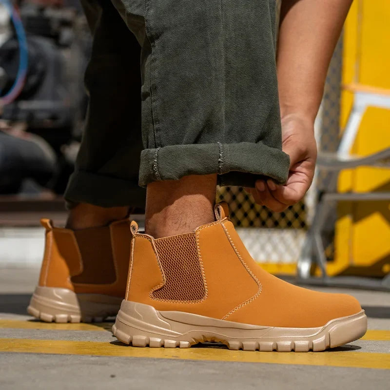 Tan slip-on boots with mesh side panels and a light sole, worn outdoors with olive trousers 4