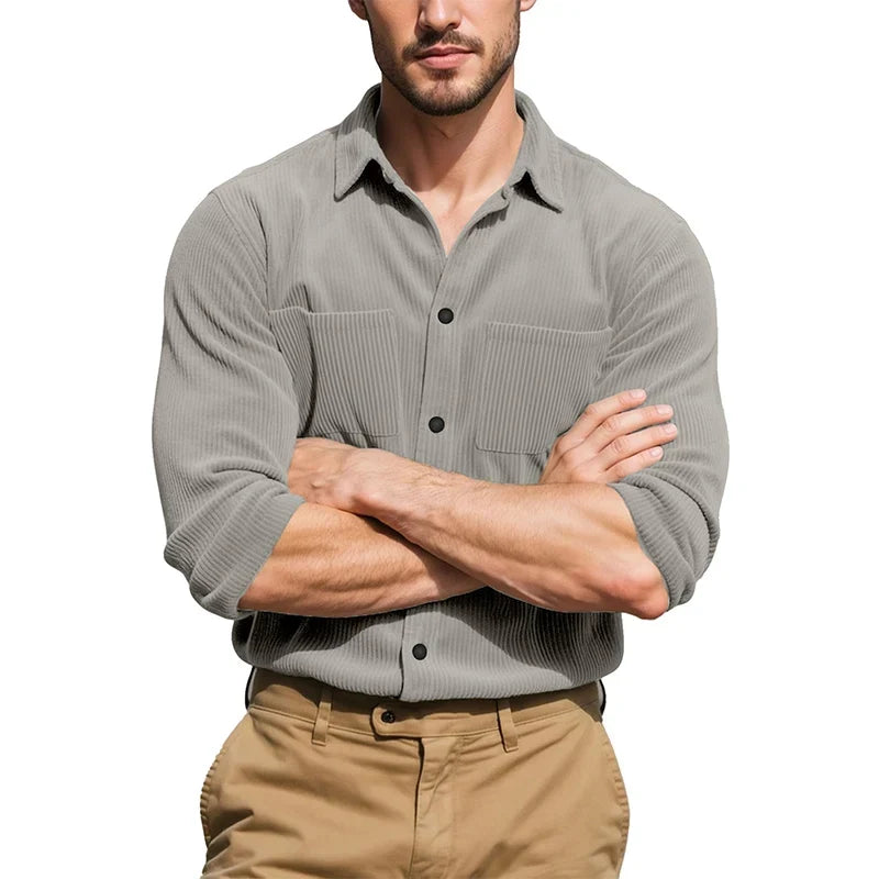 Model with arms crossed wearing the grey ribbed shirt with sleeves rolled, over khaki trousers 4