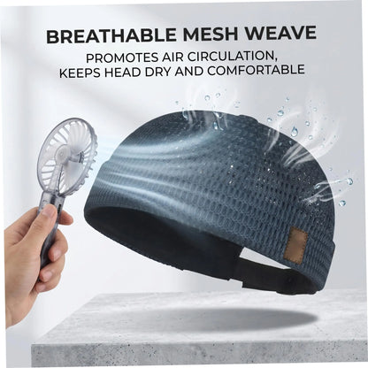 Navy mesh cap beside a handheld fan, with airflow and water droplets illustrating breathability 4