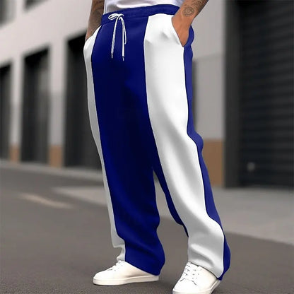 Street shot, lower body, of navy blue and white colour-block sweatpants with white drawstring 4