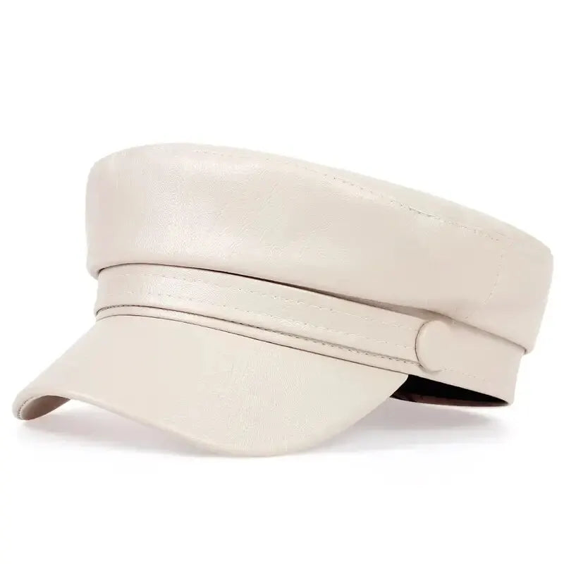 Cream baker boy hat in smooth faux leather, three-quarter view with a covered button on the band 4