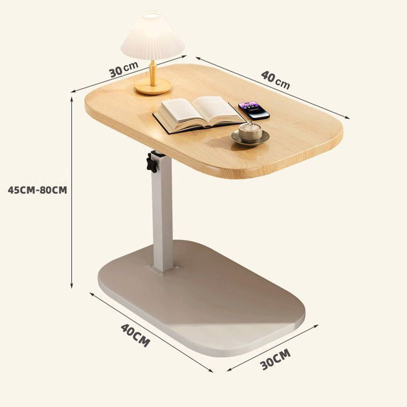 Light oak-effect desk with white base, labelled with top and base dimensions and the adjustable height range, holding a lamp, book and cup. 12