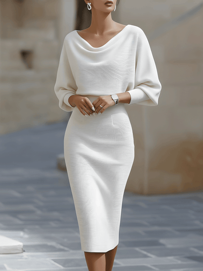 Front view of the ribbed knit midi dress in white on a model, showing the soft draped neckline and fitted waist. 2
