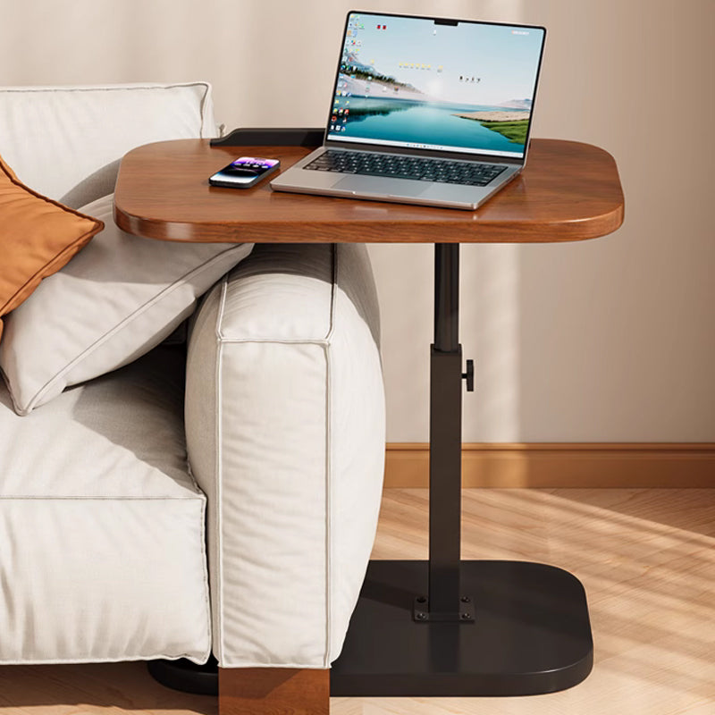 Desk top slid over a sofa arm, laptop and phone on top, with the black base tucked beneath the sofa. 11