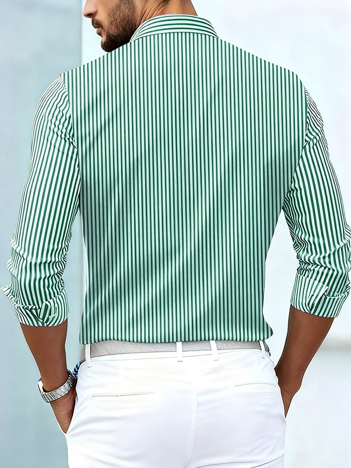 Back view on a model of the green and white striped shirt, showing plain vertical stripes across the back. 5