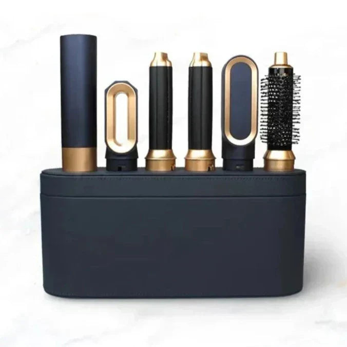 Navy and gold handle with five attachments standing upright in the matching leather-look storage case on a marble surface 5