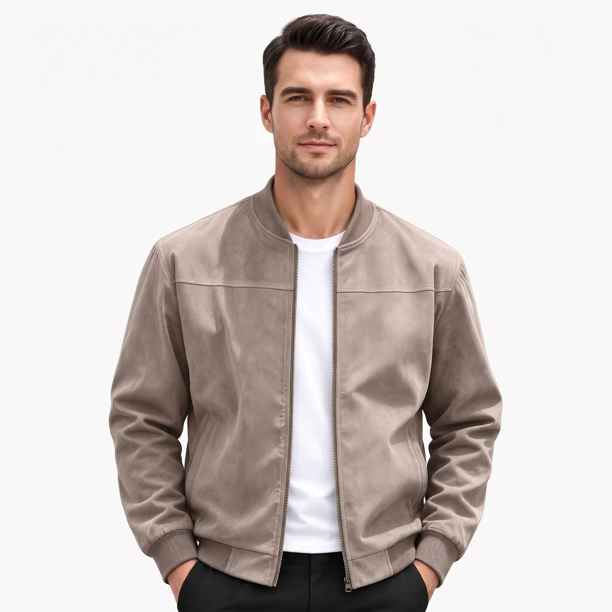 Studio shot of a model in the taupe jacket, zip open, hands in trouser pockets 50