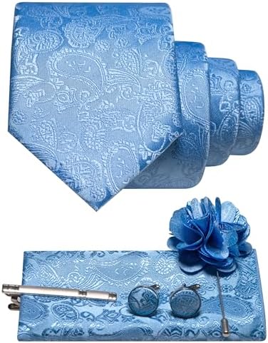Sky blue paisley tie set flat lay with rolled tie, pocket square, tie clip, cufflinks and flower brooch. 33