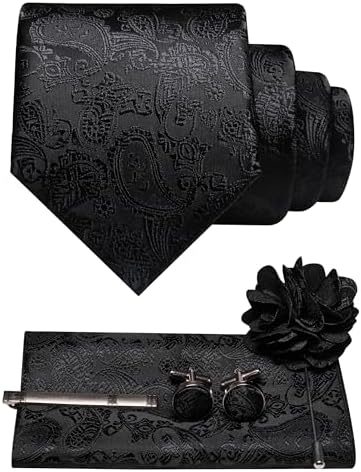 Black tone-on-tone paisley tie, pocket square, cufflinks, tie clip and flower lapel pin displayed together. 9