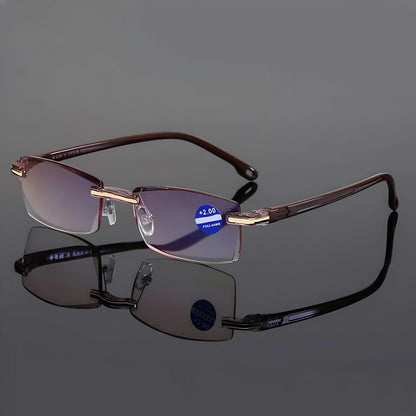 Version of the rimless glasses with brown arms and pinkish-tinted lenses, displayed on a reflective grey surface. 7