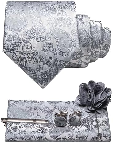 Silver-grey paisley tie set flat lay with rolled tie, pocket square, tie clip, cufflinks and flower brooch. 31