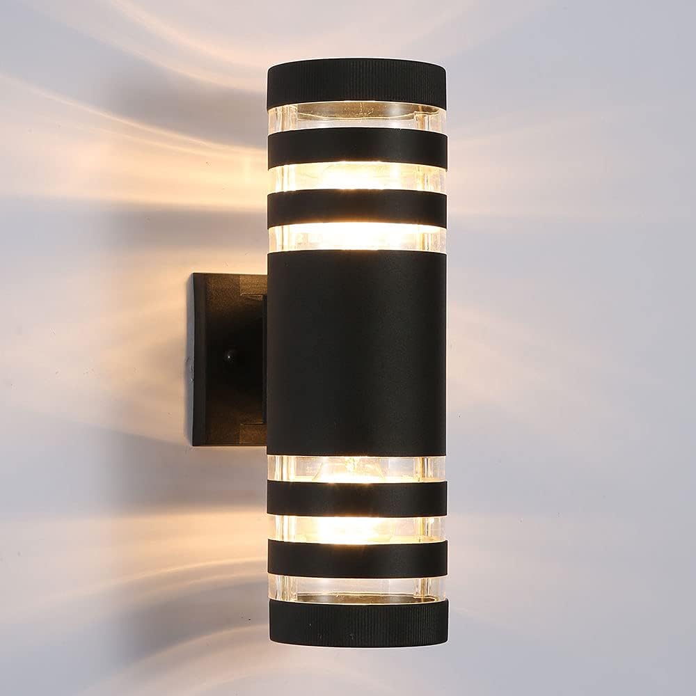Close-up of a black cylindrical sconce with two clear rings at each end and a square wall bracket 19