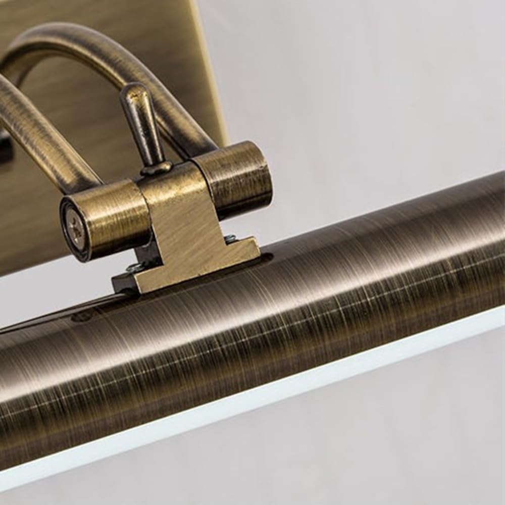 Close-up of the aged brass pivot joint and brushed tube of the light 8