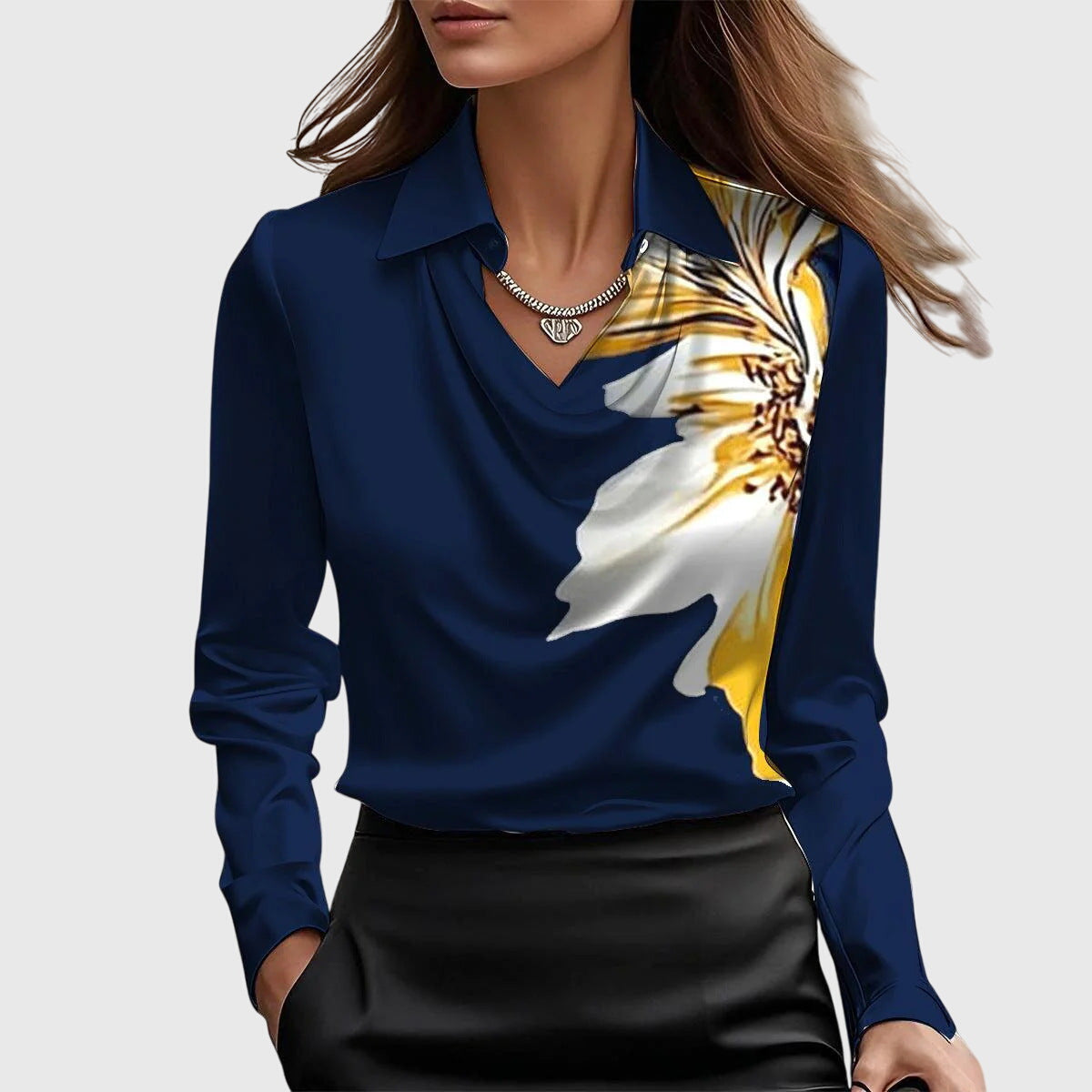 Model wearing the navy cowl-neck blouse with a large white and yellow flower printed across one shoulder, paired with a black skirt. 8