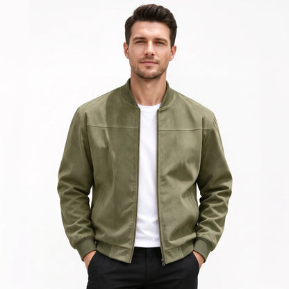 Studio shot of a model in the olive green jacket, zip open, hands in trouser pockets 53