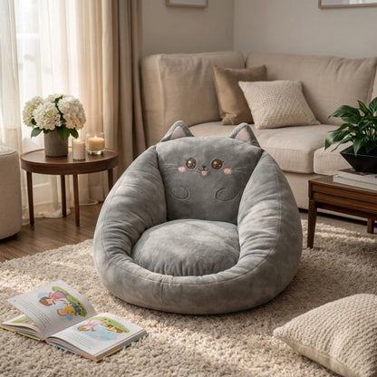Grey cat-design bean bag chair with pointed ears and embroidered face on a shaggy rug in a living room 5