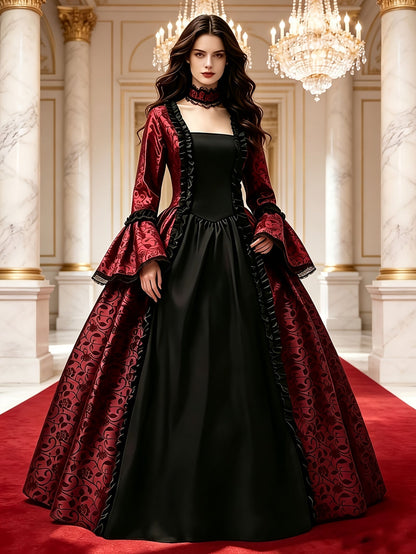 Model wearing the red and black version of the gown with lace choker, standing on a red carpet in a marble hall. 9