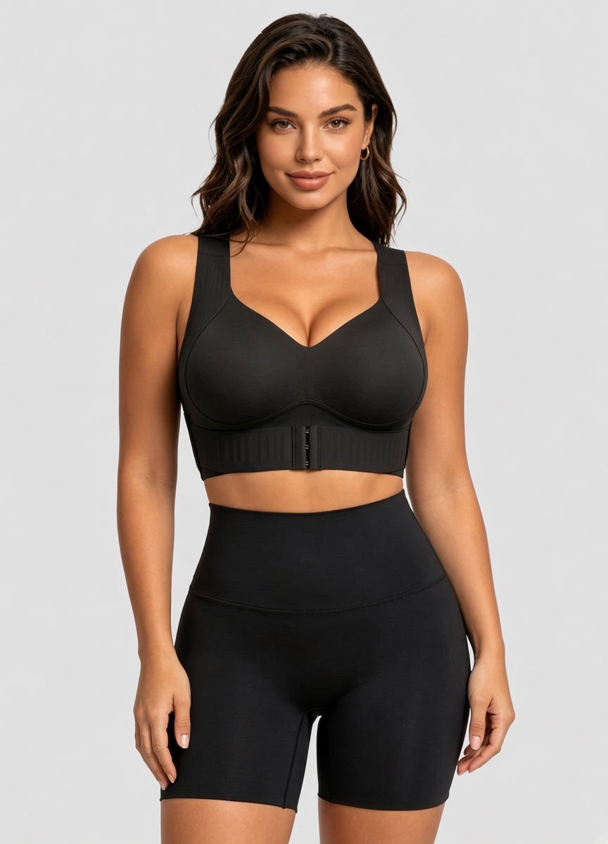 Model facing forward in the black version of the bra with front hooks, worn with high-waisted black shorts. 13