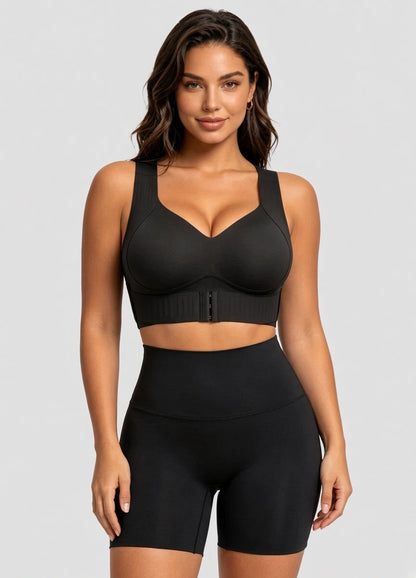 Model facing forward in the black version of the bra with front hooks, worn with high-waisted black shorts. 13