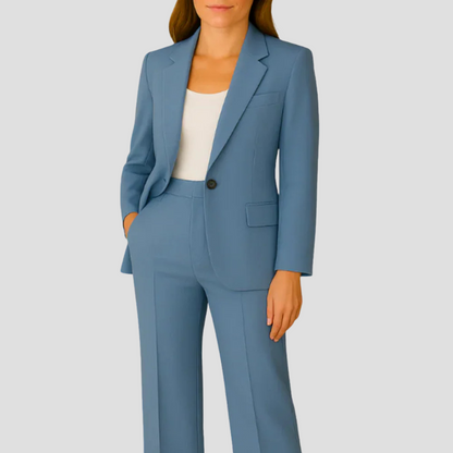 Model wearing the dusty blue suit with a white top, blazer buttoned at the waist 5