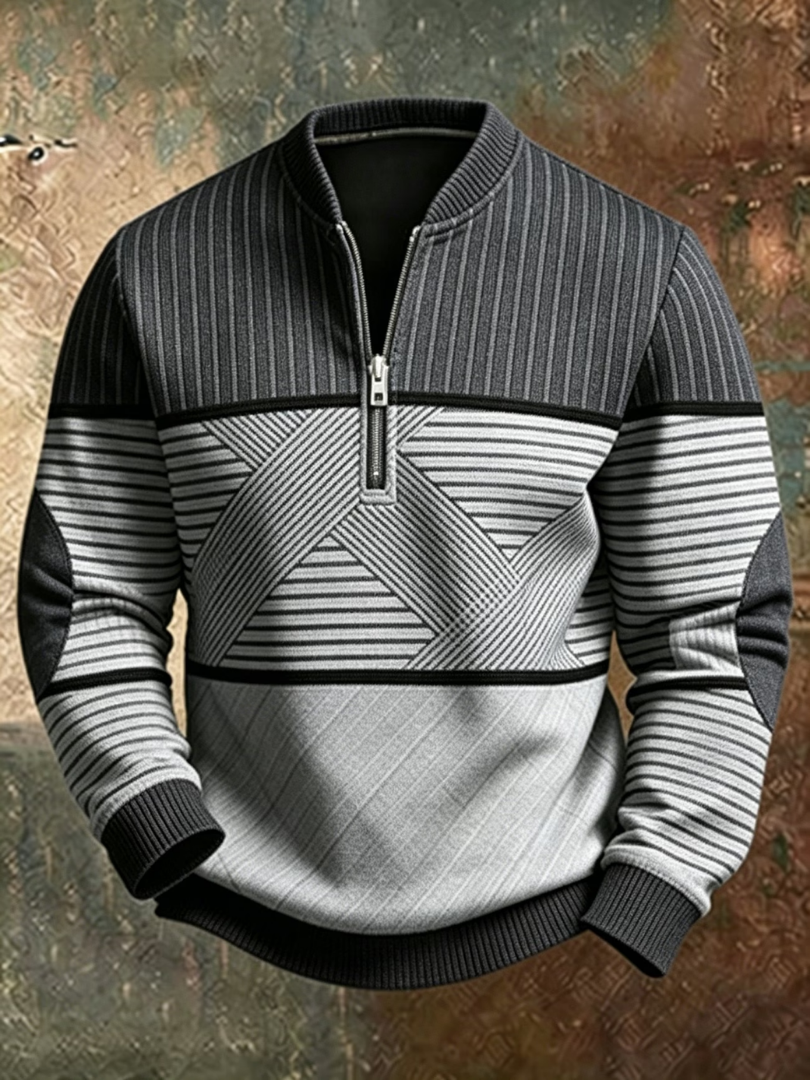 Same half-zip jumper in charcoal and light grey, with ribbed collar, crisscross striped panel, elbow patches and dark ribbed hem. 2
